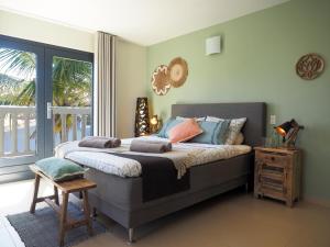 Ένα ή περισσότερα κρεβάτια σε δωμάτιο στο Oasis guesthouse, Boutique Style Hotel