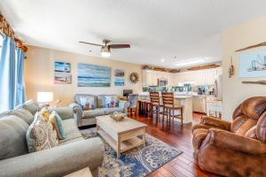 a living room with a couch and a table at Boatin' n Fishin' in Panama City Beach