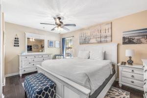 a bedroom with a bed and a ceiling fan at Boatin' n Fishin' in Panama City Beach