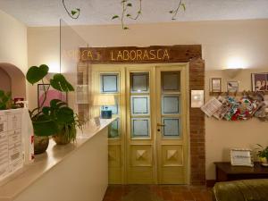 a door to a library with a sign above it at La Borasca - B&B in Casalpusterlengo