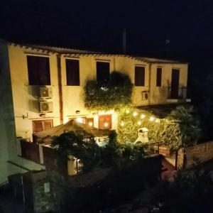 a view of a building at night with lights at VILLA CORALLINA in San Vito lo Capo