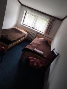 Postel nebo postele na pokoji v ubytování Gościniec Silver