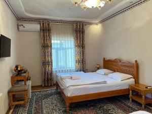 Old Bukhara Boutique客房内的一张或多张床位