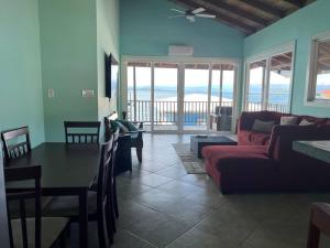 a living room with a couch and a table at Sunset View in Bastimentos