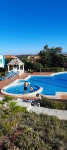 a group of people in a swimming pool at Enjoy Beloura! in Sintra
