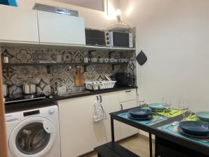 Kuchyň nebo kuchyňský kout v ubytování Dolce Hogar Residence