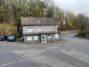 a house sitting on the side of a road at Siegen Achenbach 1 in Siegen