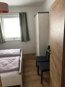 Cama o camas de una habitación en Ferienwohnung Jenny
