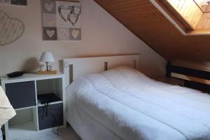 Postel nebo postele na pokoji v ubytování Duplex cocooning avec vue lac et montagnes