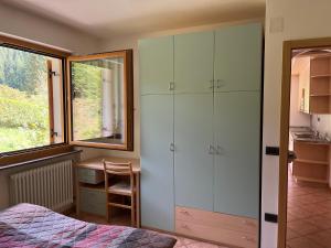 Postel nebo postele na pokoji v ubytování Appartamenti Rì de Clama