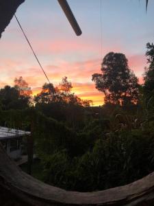 a view of a sunset from a hammock at Casa Hobbit in Salinas 
