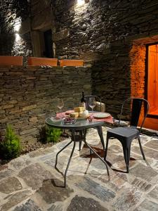 a table with a plate of food on a patio at Castas do Douro in Tabuaço