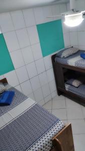 Cama ou camas em um quarto em Hostel da Floresta