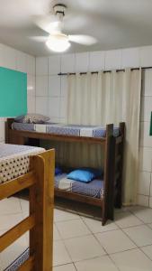 Cama ou camas em um quarto em Hostel da Floresta