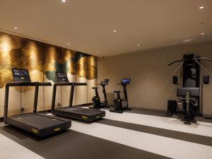 a fitness room with cardio machines and a treadmill at THE BLOSSOM KYOTO in Kyoto