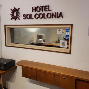 a hotel so colombia sign on a store window at Hotel Sol Colonia in Colonia del Sacramento