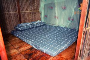 Postel nebo postele na pokoji v ubytování Ecoco Homestay Mekong