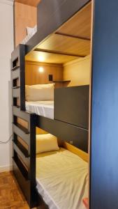 Postel nebo postele na pokoji v ubytování Lamparina Hostel