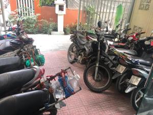 a bunch of motorcycles parked next to each other at Bon Ami Hostel in Hue
