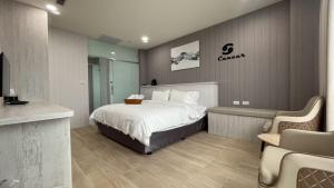Voodi või voodid majutusasutuse Twelve Constellation Garden Resort toas
