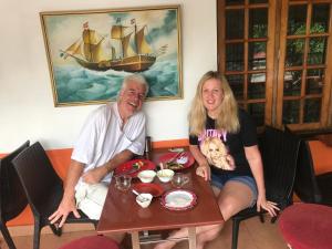 a man and a woman sitting at a table at Sajhome Fortkochi, Kochi, Kerala, inda in Cochin