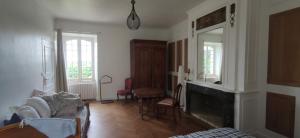Część wypoczynkowa w obiekcie Maison de Maître - chambre chez particulier