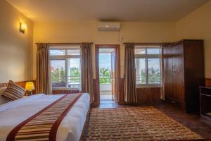 Rúm í herbergi á Siddhartha Boutique Hotel, Boudha
