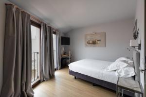 Postel nebo postele na pokoji v ubytování Hotel Boutique Posada de Sillería
