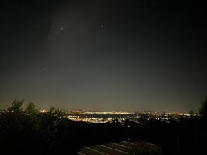 a view of a city lit up at night at Podere il Poggio in Avaglio