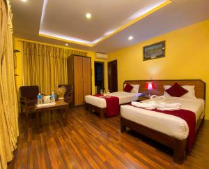 Krevet ili kreveti u jedinici u okviru objekta Thamel Grand Hotel