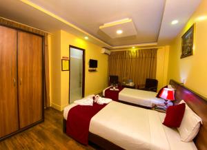 Krevet ili kreveti u jedinici u okviru objekta Thamel Grand Hotel