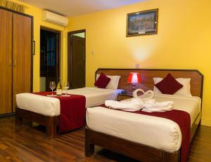 Krevet ili kreveti u jedinici u okviru objekta Thamel Grand Hotel