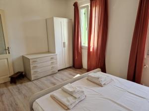 Postel nebo postele na pokoji v ubytování Casa Rafut