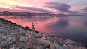 a view of a body of water at sunset at Sea 1 in Civitanova Marche