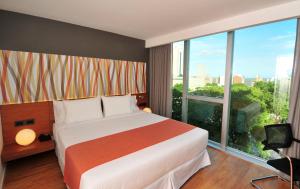 Voodi või voodid majutusasutuse BIT Design Hotel toas