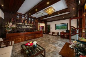 a lobby of a restaurant with a waiting room at Hanoi Nostalgia Hotel & Spa in Hanoi