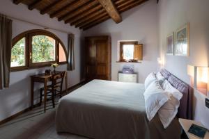 Postel nebo postele na pokoji v ubytování Incanto Toscano