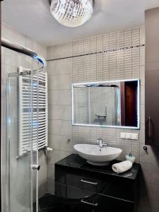 Kúpeľňa v ubytovaní Trevilles Apartamenty Londyn