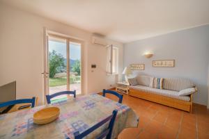 A bed or beds in a room at Appartamenti Baia Blu
