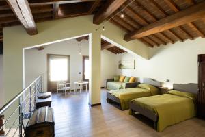 a bedroom with two beds and a living room at Incanto Toscano in Larciano +116 photos