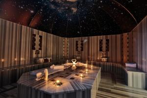 a dining room with a table with stars on the ceiling at Kapadokya Hill Hotel & Spa in Nevşehir