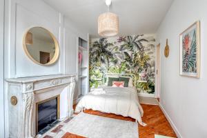 Łóżko lub łóżka w pokoju w obiekcie Ambiance Jungle et Cocon en hyper centre pour 2, 4 ou 6 pers - MyLittleStay