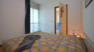 Ένα ή περισσότερα κρεβάτια σε δωμάτιο στο Residenza Olimpo