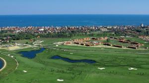 an aerial view of the golf course at a resort at Ulisse Palace in Lido di Jesolo