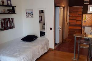 a bedroom with a bed and a table and a door at Sol y playa in Benalmádena +63 photos