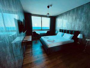 Ένα ή περισσότερα κρεβάτια σε δωμάτιο στο Carmel Holiday Apartments