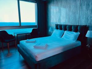 Ένα ή περισσότερα κρεβάτια σε δωμάτιο στο Carmel Holiday Apartments