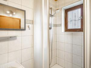 a bathroom with a shower and a sink and a mirror at Holiday Home Richter by Interhome in Zistl