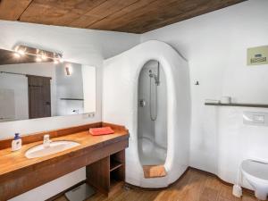 a white bathroom with a sink and a shower at Apartment Schraudoplh by Interhome in Winklerdörfl