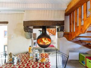 a kitchen with a fire oven in a room at Holiday Home Les Trois Baudets by Interhome in Elliant